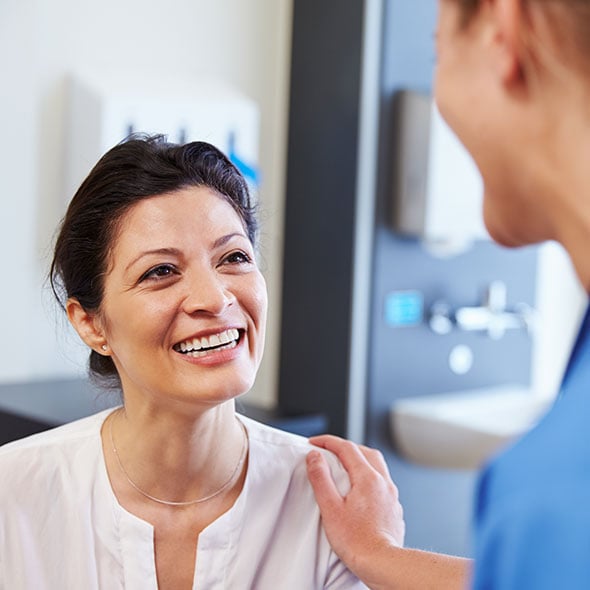 Woman at the doctor who uses a personal loan to pay for her medical bills.