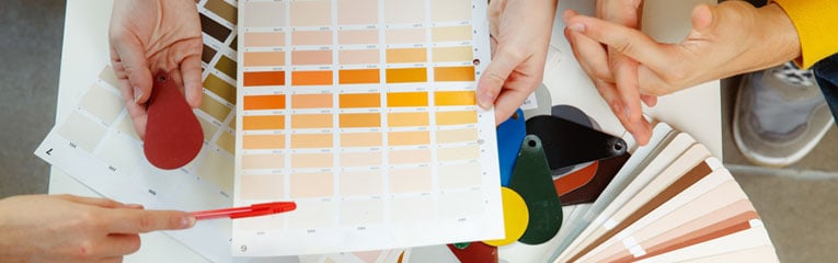 Couple-and-interior-designer-making-color-choices-for-their-newest-home-improvement-project.