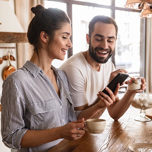 Couple at home skipping a payment on their home loan.