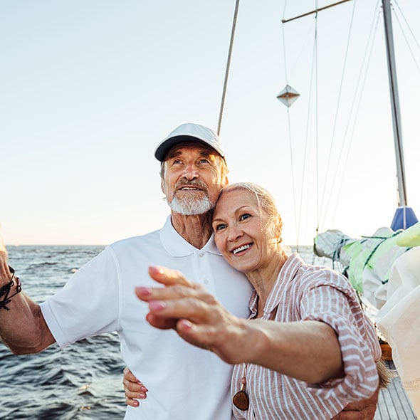 Couple skipping a payment on their boat with a skip-a-payment feature from CCCU.