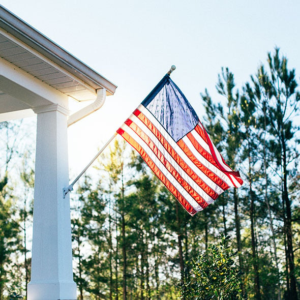 American flag swinging on front porch of military officer who got a VA loan through CCCU credit union in Portland Oregon