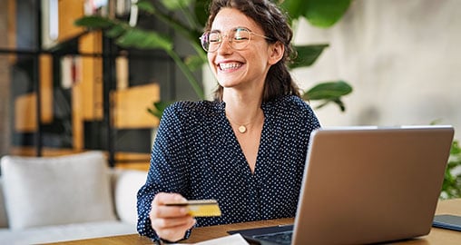 Girl about to use her simple checking debit card with CCCU.