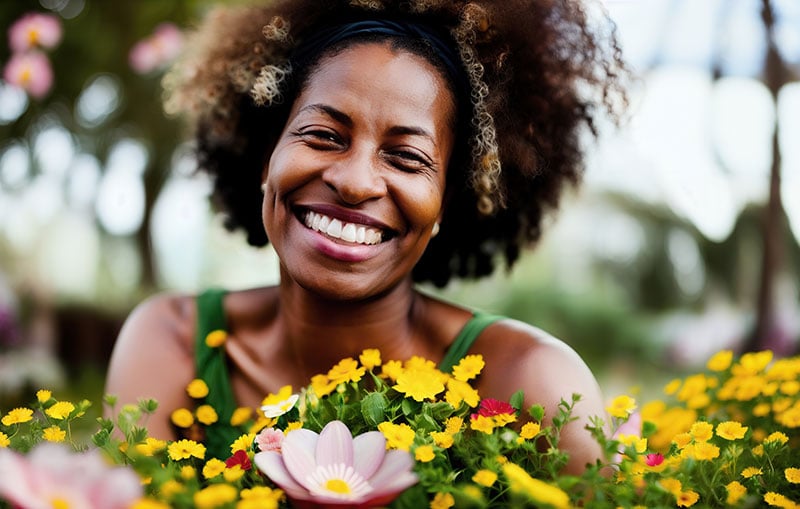 Joyful woman with flowers who banks with CCCU.