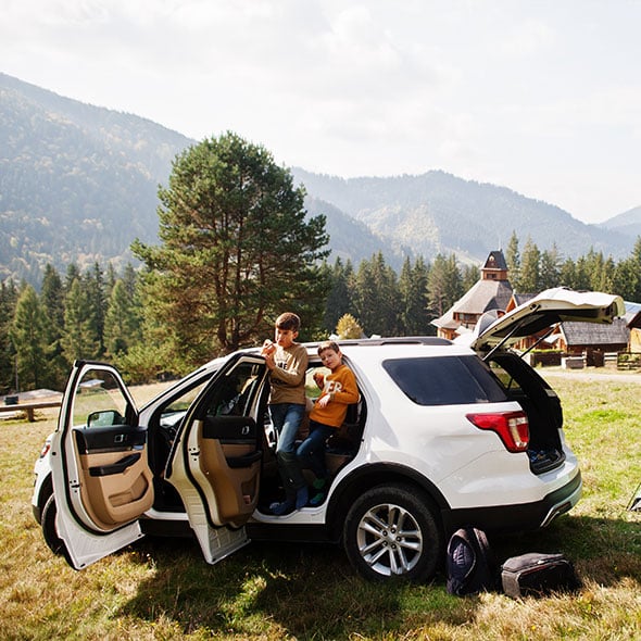 Kids camping in the family car that was purchased through consolidated community credit union in Portland Oregon.