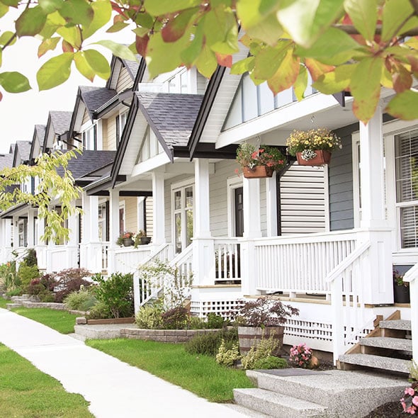 Cute white houses in Portland Oregon neighborhood purchased with FHA loan from CCCU local credit union.