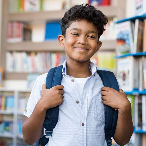 A young student boy who is excited about the future and has college savings account with CCCU credit union in Portland Oregon.