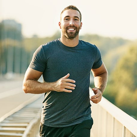 Young man running home from the military, looking to purchase a home with a VA loan through CCCU Credit Union in Portland Oregon.