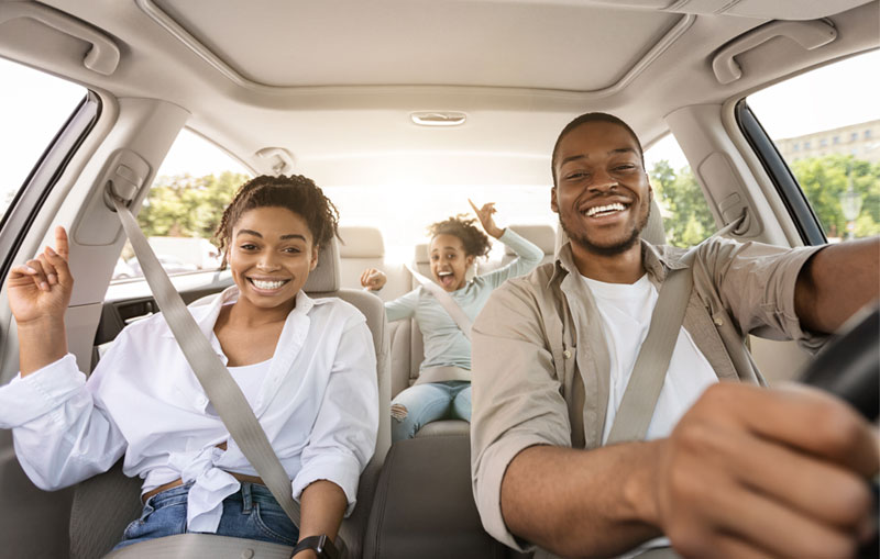 African-american-family-smiling-driving-home-with-the-best-car-after-financing-the-car-loan-with-CCCU.