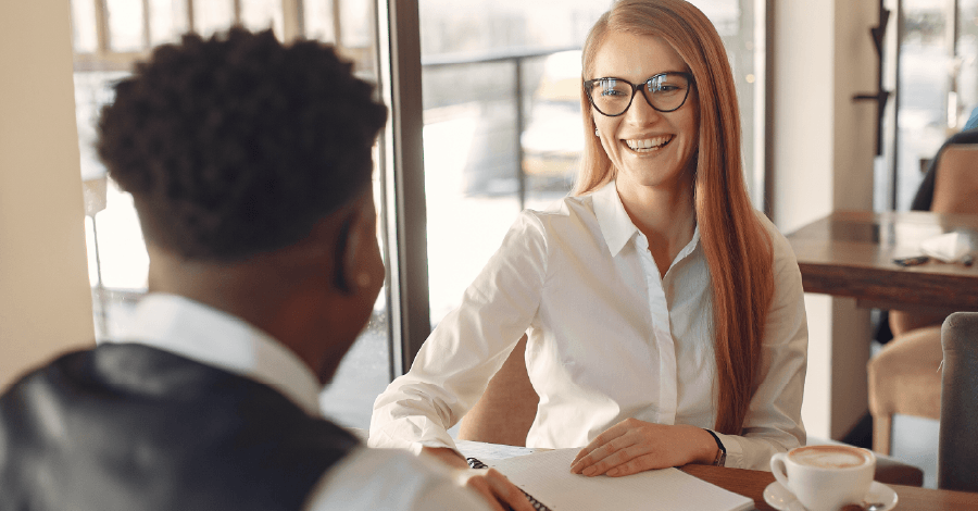 Woman in white dress shirt getting pre approved for a mortgage at CCCU.