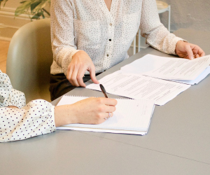 Two people going over documents.