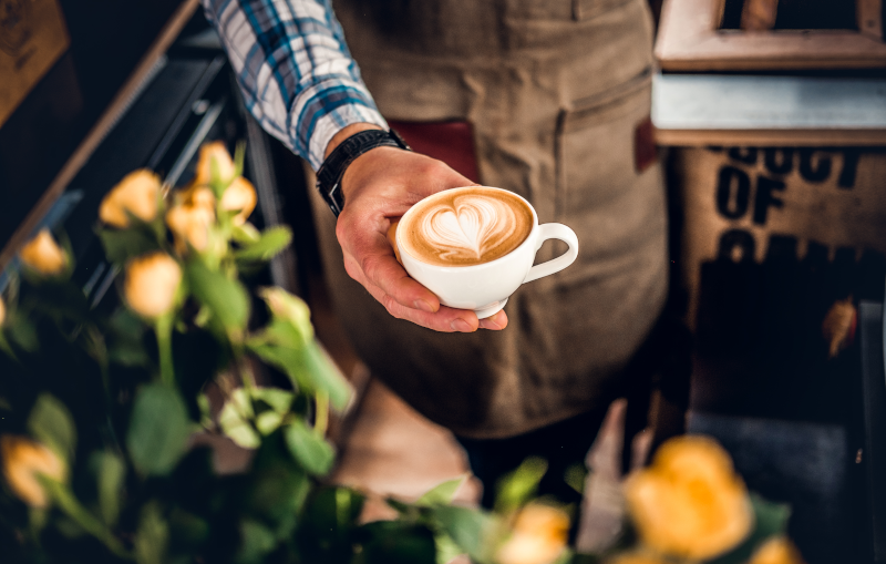 a man holding a coffee mug.