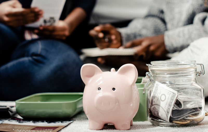 mother teaching her daughter about savings