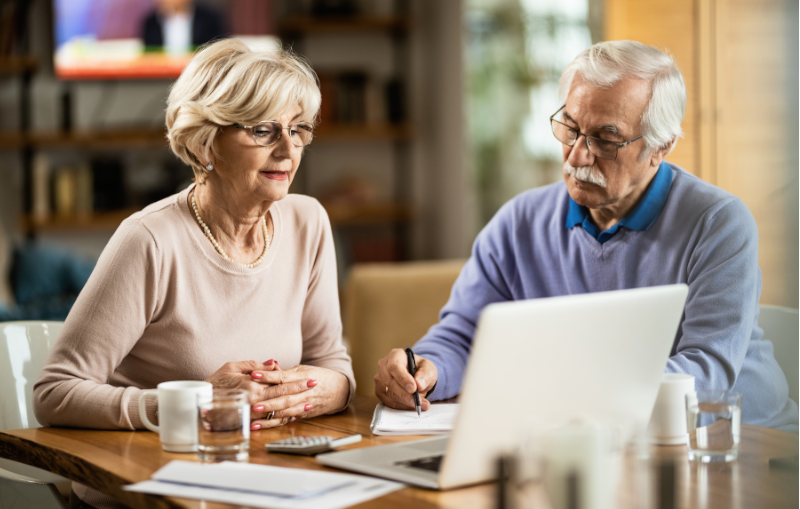 senior couple researching their home refinancing options