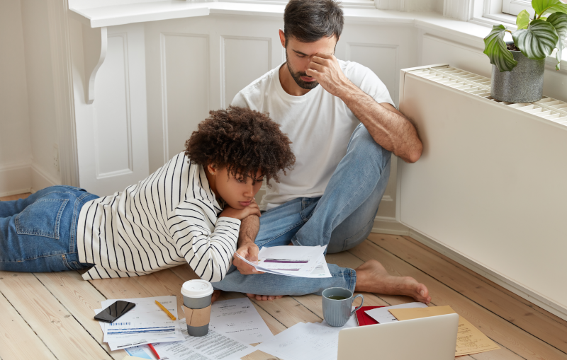 young couple working on their monthly budget